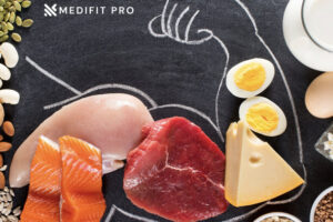 High protein food against a black board Medifitpro.com
